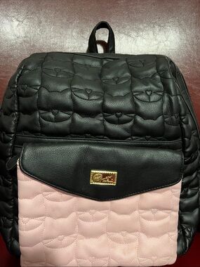 Betsy JohnsonQuilted Black and Pink Women's Backpack with Gold Plaque